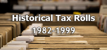 Historical Tax Rolls from 1982 to 1999. Picture of stacks of tax documents.